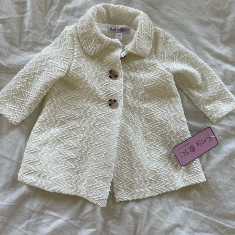 Cream baby girl over coat